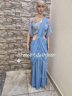 Stylish indo western party wear pre stitched georgette saree embellished with embroided blouse and belt. Custom made for all the sizes. Stitching  For stitched dresses you can chose from size chart or can message us for customization.our team will send you size chart for customization. Feel free to convo for any details to help you in your selection because customize dresses cannot be return or exchange. Note: color may slightly vary because of different screen resolutions. We have an expert customization team .if you have any problem regarding taking measurements please convo for our help. All the measurements are rechecked before dispatch. Saree Half Saree, Saree Dhoti, Embroided Blouse, Indo Western Outfit, Western Party Wear, Dhoti Saree, Western Party, Western Outfit, Drape Saree