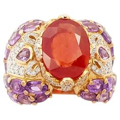 Orange Sapphire 4.79 carats, Purple Sapphire 8.10 carats and Diamond 0.78 carat Ring set in 18K Rose Gold Settings Width: 2.5 cm Length: 1.9 cm Ring Size: 56 Total Weight: 18.62 grams Orange Sapphire Width: 1.0 cm Length: 1.3 cm "We first opened doors in 1980 when it was then situated in the vicinity of the Victory Monument; a small and modest storefront with a couple of counters. From its humble beginnings to where it stands today, our company has proven its abilities as a jeweler. Since the be Sapphire Cocktail Ring, Purple Ring, Rings Antique, Purple Rings, Purple Sapphire, Diamond Cocktail Rings, Diamond Ring Settings, Orange Sapphire, Antique Rings