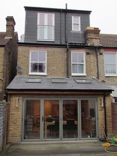 a large house with lots of windows in the front