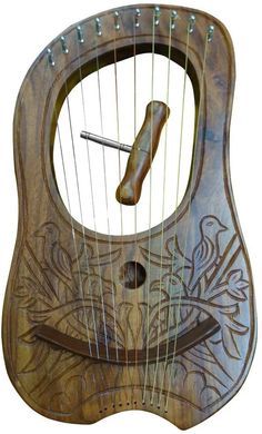 a wooden instrument with an intricate design on it