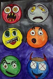 an art project with different colored faces