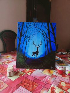 a painting of a deer standing in the middle of a forest