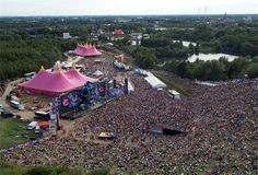 an aerial view of a large crowd at a music festival