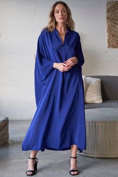 Experience laid-back glamour with our cobalt blue silk caftan. Featuring a delicate collar, back pleat, and side slits, it offers effortless elegance. Shop Now! Talitha Getty, Silk Caftan, Loungewear Dress, Caftan Tunic, Kaftan Designs, Gauze Dress, By The Ocean, Feeling Blue, Effortless Elegance