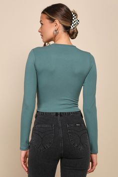 The Lulus Begin with the Basics Teal Green Long Sleeve Crop Top is the perfect layering piece for chilly days! Soft stretch knit shape this essential top that has a crew neckline and long sleeves. The fitted bodice ends at a cropped hem that's perfect for pairing with high-waisted jeans! Fit: This garment fits true to size. Length: Size medium measures 17.5" from shoulder to hem. Bust: Great for any cup size. Waist: Fitted - stretchy fabric allows custom fit. Undergarments: May be worn with any Fitted Long Sleeve Top In Solid Color, Fitted Long Sleeve Top For Layering, Elastane Long Sleeve Top For Layering, Trendy Long Sleeve Crew Neck Top With Thumbholes, Versatile Long Sleeve Ribbed Top, Fitted Crew Neck Crop Top For Layering, Solid Crew Neck Top With Thumbholes, Fine Knit Long Sleeve Tops, Winter V-neck Elastane Top