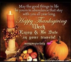 a thanksgiving greeting with pumpkins, apples and other autumn items in front of a lit candle