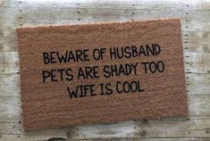 a door mat that says beware of husband pets are shady too wife is cool