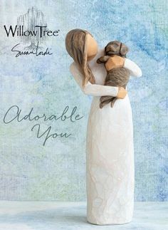 a ceramic figurine of a woman holding a dog with the words willow tree san francisco available for dogs lovers