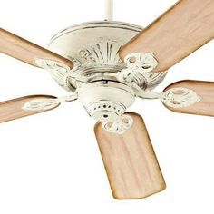 a white ceiling fan with wooden blades