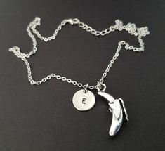 "Personalized Silver Banana Necklace! A three dimensional banana charm on a bright silver chain makes the perfect gift for you or a loved one. The detailed banana charm is made from zinc alloy and measures 28 mm by 11 mm. The chain is silver plated and measures 16\" or 18\" with a 1\" extender. You can also personalize your necklace with a .5\" silver plated disc stamped with the initial of your choice. To order your necklace WITHOUT a custom stamped initial disc, choose \"Charm & No Initial Silver Necklaces With Charms, Personalized Adjustable Metal Charm Necklaces, Novelty Pendant Charm Necklace As Gift, Novelty Pendant Charm Necklace For Gift, Novelty Pendant Charm Necklace Gift, Personalized Green Sterling Silver Charm Necklaces, Personalized Green Sterling Silver Charm Necklace, Sterling Silver Novelty Necklace For Gift, Silver Novelty Necklace For Gift