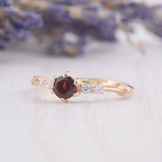 Simple & dainty 14k rose gold garnet engagement ring, Small tiny womens engagement ring,Garnet promise ring for her,Gold womens promise ring WE OFFER UNLIMITED PERIOD INSTALLMENTS PLAN This is a beautiful, stunning, feminine ring that works well for all occasions, styles, and ages. You will love it! Ring information: Main stone: Garnet Approximate size: 4.0mm Accent stones: Cubic zirconia Approximate size: 1.75mm (6 stones) Metal type: Gold Metal stamp: 14k Gold Installment Payments We offer Dainty Ruby Ring With Prong Setting For Promise, Garnet Diamond Promise Ring In Yellow Gold, Yellow Gold Garnet Diamond Promise Ring, Garnet Diamond Ring With Prong Setting For Promise, Dainty Garnet Jewelry For Anniversary, Elegant 14k Rose Gold Ruby Promise Ring, Dainty Rose Gold Ruby Promise Ring, 14k Rose Gold Promise Ring Jewelry, Dainty Ruby Ring With Prong Setting