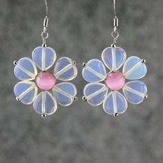 "The unique flower earrings are handmade using gemstone moonstone and pink cat eye. Free US shipping Customers who purchased this item said: \"Much prettier than the picture. The petals seem to change colors! Thank for the gift\" \"Beautiful and very well mademuch more than I expected since they are inexpensive. \" The flower is dainty and soft. It is the ultimate of femininity. The translucent quality of jade accentuate the lightness of the design. The length of the flower is 1 inch, or 2.5 cm. Pink Flower Earrings Gift For Her, Cute Pink Jewelry As A Gift For Her, Whimsical Flower Shaped Jewelry For Gift, Whimsical Flower Shaped Jewelry As Gift, Cute Pink Sterling Silver Jewelry, Whimsical Flower Shaped Jewelry Gift, Whimsical Flower-shaped Jewelry Gift, Pink Flower Shaped Jewelry As A Gift For Her, Pink Sterling Silver Flower Earrings For Gift