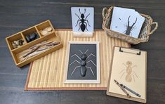 a bamboo mat with various items on it including cards, pen and inkbrushes