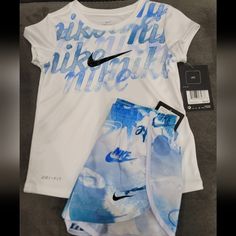 Nike Girls Tshirt And Shorts Set, Size 5 Sporty White Sets With Graphic Print, Sporty White Graphic Print Sets, Nike White Casual Sets, Nike Casual White Sets, White Nike Casual Sets, Casual White Nike Sets, Nike White Sets For Spring, Nike White Summer Sets, White Nike Summer Sets