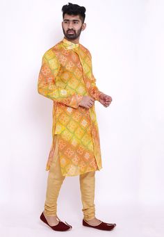 Readymade Art Kota Silk Front Open Kurta in Shaded Yellow and Orange. This Collar Neck and Full Sleeve attire is Prettified with Buttons, Bandhej and Foil Print and has Two Side Pockets. Available with an Art Silk Churidar in Beige. Do note: Footwear shown in the image is for presentation purposes only. Half to one inch may vary in measurement. (Slight variation in actual color vs. image is possible). Multicolor Bandhani Print Kurta For Transitional Season, Fitted Multicolor Self Design Kurta, Fitted Patterned Sets For Festive Occasions, Long Sleeve Multicolor Kurta With Self Design, Multicolor Long Sleeve Kurta With Self Design, Yellow Kurta With Bandhani Print For Festivals, Yellow Bandhani Kurta For Festivals, Fitted Yellow Bandhani Traditional Wear, Fitted Patterned Kurta For Festive Occasions