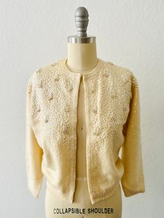 Vintage 50s Chantilly Cream Angora cardigan-Iridescent sequin beaded with Tassels-Hook and eye front closure-3/4 sleeve with silk lining Size:  XS, S Condition:  Good vintage condition, collar has been reinforced with sewn ribbon Elegant Sequined Sweater For Fall, Elegant Sequin Sweater, Elegant Sequined Cardigan For Fall, Elegant Winter Cardigan With Sequins, Fitted Spring Sweater With Sequins, Spring Fitted Sweater With Sequins, Elegant Spring Cardigan With Sequins, Elegant Sequined Cardigan For Spring, Fitted Glamorous Winter Sweater