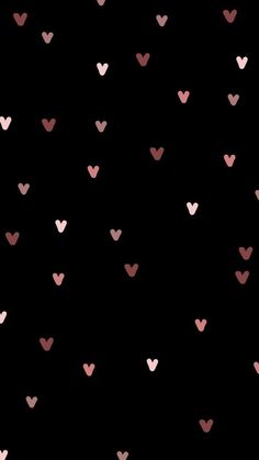 pink and black hearts are arranged in the shape of heart shapes on a black background