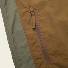 Seabreacher Jacket – HOWLER BROTHERS Fall Camping Windbreaker With Pockets, Sporty Travel Windbreaker With Pockets, Sporty Windbreaker With Pockets For Travel, Functional Travel Windbreaker With Pockets, Casual Windbreaker With Adjustable Hood For Camping, Casual Camping Windbreaker With Pockets, Brown Nylon Outdoor Outerwear, Green Nylon Windbreaker For Travel, Midweight Nylon Windproof Windbreaker