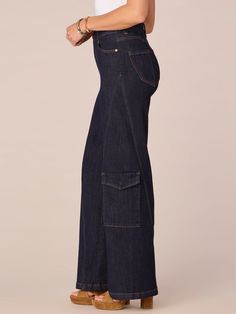 It’ll be love at first fit when you slip into these on-trend “Ab”solution® Wide Leg jeans, featuring a skyrise waist, cargo pockets, and an uneven yoke. With our signature fit technology, these bottoms will feel like they’re made with you in mind, thanks to strategically placed back pockets, a hidden “no gap” elastic waistband, and ultra-soft stretchy denim.• Skyrise• Dark indigo• Stretch smooth denim• 2% spandex• Button front and zip fly closure• Cargo pockets• Uneven yoke• Strategically placed back pockets• Hidden “no gap” elastic waistbandStyle# B28217KSL• Skyrise approx. 11”• Inseam approx. 32”• Leg opening approx. 24”