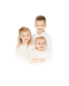 three children are posing for the camera