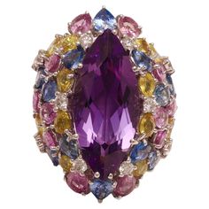 Magnificent 18kt White Gold Ring With Huge Marquise Cut Amethyst Center Stone & Blue, Pink Sapphires, Diamonds Centre stone: amethyst Approx. 20 Ct Diamonds: brilliant cut together 0.58 ct. Pink, blue and yellow sapphire Approx. 14 Ct Material: 18kt white gold Ring size: 50 EU / 5.25 US ( can be resized for free) Total weight: 19.1 gram / 0.675 oz / 12.3 dwt Gold Ring Big, White Gold Ring, Yellow Sapphire, Gem Stone, Marquise Cut, Sapphire Diamond, Pink Sapphire, White Gold Rings, Gold Ring