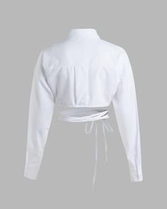 Details: White long-sleeve crop shirt with waist-line string designTop Length: CroppedSleeve Length: Long SleevesMaterials:95% Polyester + 5% Spandex Shirt With Tie, Crop Top Blouse, Maxi Dress Party, Collared Shirt, Knitwear Cardigan, Dress Cuts, Sweater Blouse, Crop Shirt, Cardigan Jacket