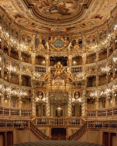 an ornately decorated auditorium with chandeliers