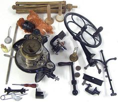 an assortment of tools are displayed on a white surface