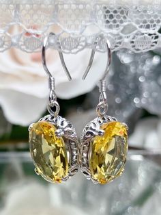 Citrine earrings, yellow citrine earrings with Edwardian sterling silver filigree and traditional wire closures, Silver Embrace Jewelry Yellow Earrings With Intricate Design For Gift, Classic Yellow Oval Earrings, Classic Citrine Earrings, Oval Citrine Gemstone Earrings, Elegant Oval Citrine Earrings, Yellow Filigree Jewelry, Yellow Oval Citrine Earrings, Yellow Oval Gemstone Earrings, Classic Yellow Citrine Earrings