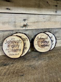 two wooden coasters with names on them