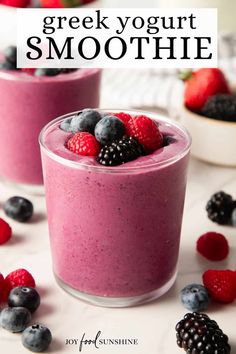 two glasses filled with fruit and yogurt smoothie on top of a table