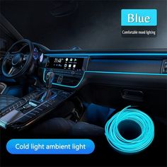 the interior of a car with blue lights on and an electronic instrument in front of it