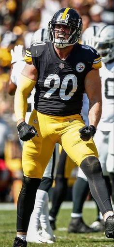 a football player standing on top of a field