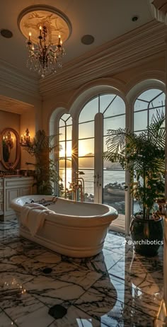 a large bathroom with an oval tub and chandelier