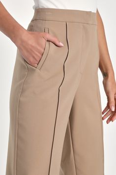 From the desk to after-hours fun, the Lulus Chic Business Khaki High-Waisted Trouser Pants will have you looking fab! Stretch-woven fabric shapes these chic trousers with a seamed detail that travels down the tapered legs to ankle-length hems. Functional side pockets frame the high waistband that has a hidden fly with clasp closure and top button, while a decorative welt pocket adorns the back. Fit: This garment fits true to size. Length: Ankle length. Size medium Inseam: 28.00 Front Rise: 11.75 Trendy Wide Leg Office Bottoms, Trendy Wide Leg Bottoms For Office, Modern Beige Bottoms For Office, Trendy Seam-detailed Bottoms For Work, Beige Stretch Bottoms For Office, High Waisted Trouser Pants, Size Sorting, Chic Trousers, You Look Fab