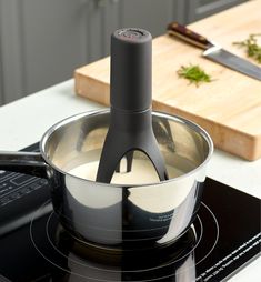 an electric stove top with a mixer on it