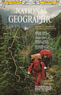 the cover of national geographic magazine shows two hikers hiking up a mountain