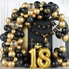 a black and gold 18th birthday party with balloons