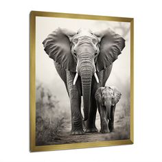 an elephant and her baby walking together in black and white with gold frame on the wall