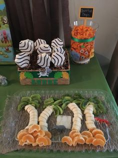 an assortment of fruits and vegetables on a table at a children's birthday party