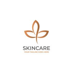 the logo for skin care is made up of two leaves and one has a brown outline