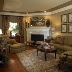 a living room filled with furniture and a fire place