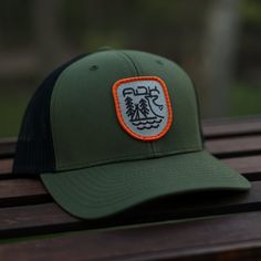 Time spent in the backcountry is often a time full of quiet moments taken to reflect on the forest and the wildlife that calls it home. Our backwoods hat pays homage to the whitetail deer, one of the most popular species in the Adirondacks - both respected by hunters for what they provide and appreciated by animal lovers. Cotton Twill Trucker Hat Mid-Height (Profile) Crown Mesh Backing Pre-Curved Visor & Classic Snapback The front includes an embroidered patch design by Shane LaChance Rustic Outdoor Cap, Rustic Outdoor Hat, Green Trucker Hat With Flat Brim For Camping, Green Flat Brim Trucker Hat For Camping, Green Trucker Hat With Curved Brim For Camping, Green Flat Brim Snapback Hat For Camping, Adjustable Snapback Trucker Hat For Hunting, Outdoor Snapback Trucker Hat With Moisture-wicking, Hunting Snapback Trucker Hat