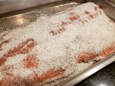 a metal pan filled with food on top of a counter