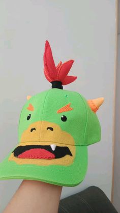 a person wearing a green hat with an angry bird on it