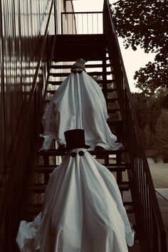 a couple of umbrellas sitting on top of a set of stairs