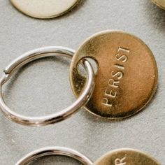 three different types of personalized metal key chains