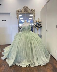 a dress on display in front of a mirror