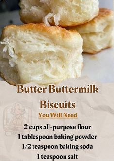 two buttermilk biscuits are stacked on top of each other