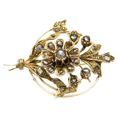 An antique brooch with 28 diamonds in old Dutch rosette cuts (round, irregular shape) set in a filigree floral form in a circle, in the realism trend of the mid-19th century. Naturalism, which was particularly fashionable at that time, was manifested in jewelry by intricate representations of floral bouquets, twigs and leaves tied with ribbons and embedded with precious stones. The gold brooch is made of 0.580 yellow gold with 0.900 silver elements, studded with 28 diamonds with a total weight of 0.80ct Color/purity G-I/SI-I1 Width: 4cm Length: 3cm The purchase is accompanied by a jewelry certificate from a diamond appraiser. Antique Brooches, Gold Brooches, Floral Bouquets, Antique Gold, 19th Century, Gold Diamond, Precious Stones, Favorite Jewelry, Yellow Gold